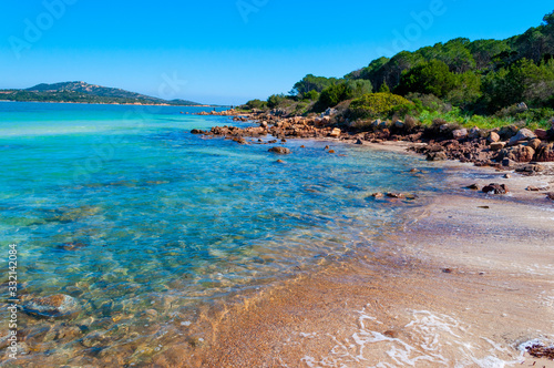 Rocks and clear water in Lu Impostu beach in photo