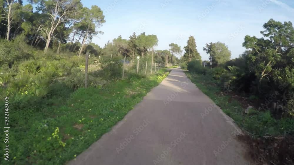 Shadow of a cyclist on a bike lane in Sardinia, Italy Shadow of a cyclist on a bike lane in Sardinia, Italy