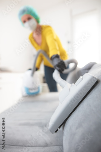 Home, apartment and room sterilization, cleaning, vacuuming with vacuum cleaner in the time of dangerous viruses.