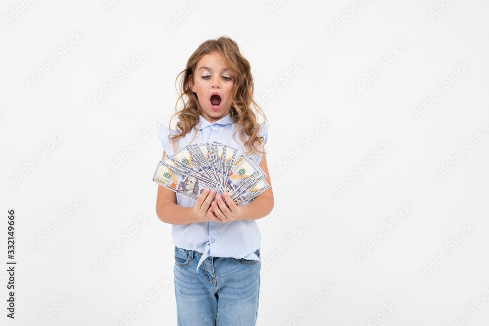 happy teenager girl holding money on a white background with copy space happy teenager girl holding money on a white background with copy space