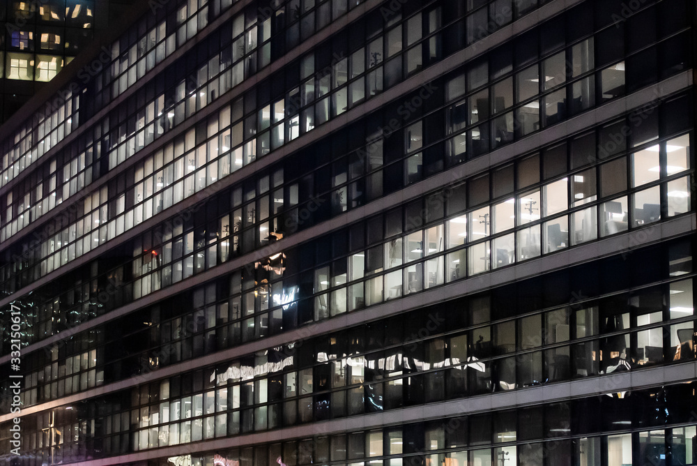 Obraz premium business office at night - corporate building