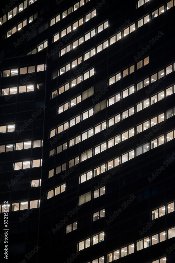 Obraz premium business office at night - corporate building