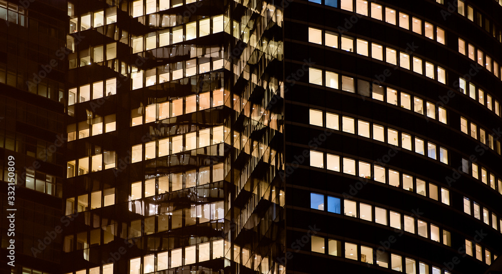 Obraz premium business office at night - corporate building