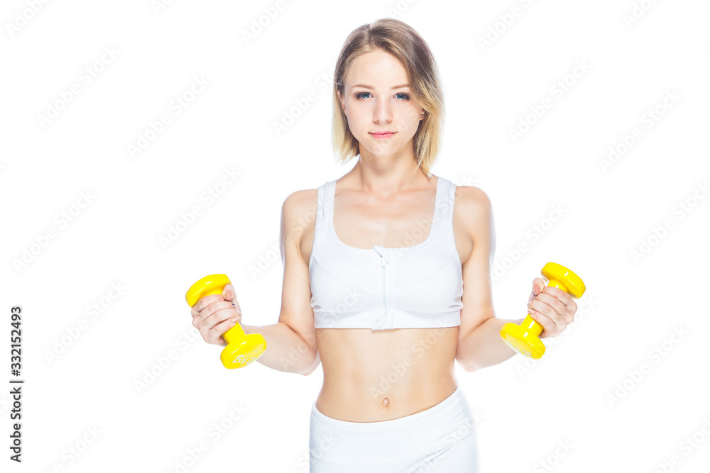 Fitness woman working out with yellow dumbbells showing her muscles on white background Fitness woman working out with yellow dumbbells showing her muscles on white background
