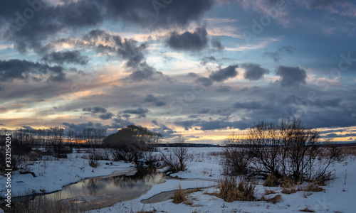 spring landscape in a field at sunset, Russia, Ural,