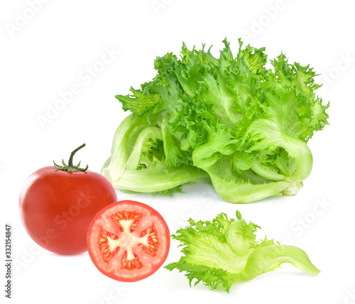 Fresh single tomato and  green lettuce leaves isolated on white background