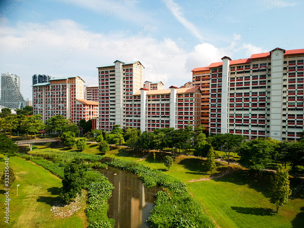 Residential buildings in the background of a neighborhood park