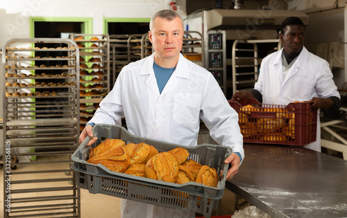 Bakers working in bakehouse