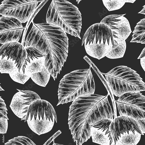 Hand drawn sketch hazelnut seamless pattern. Organic food vector illustration on calk board. Vintage nut illustration. Engraved style botanical background.