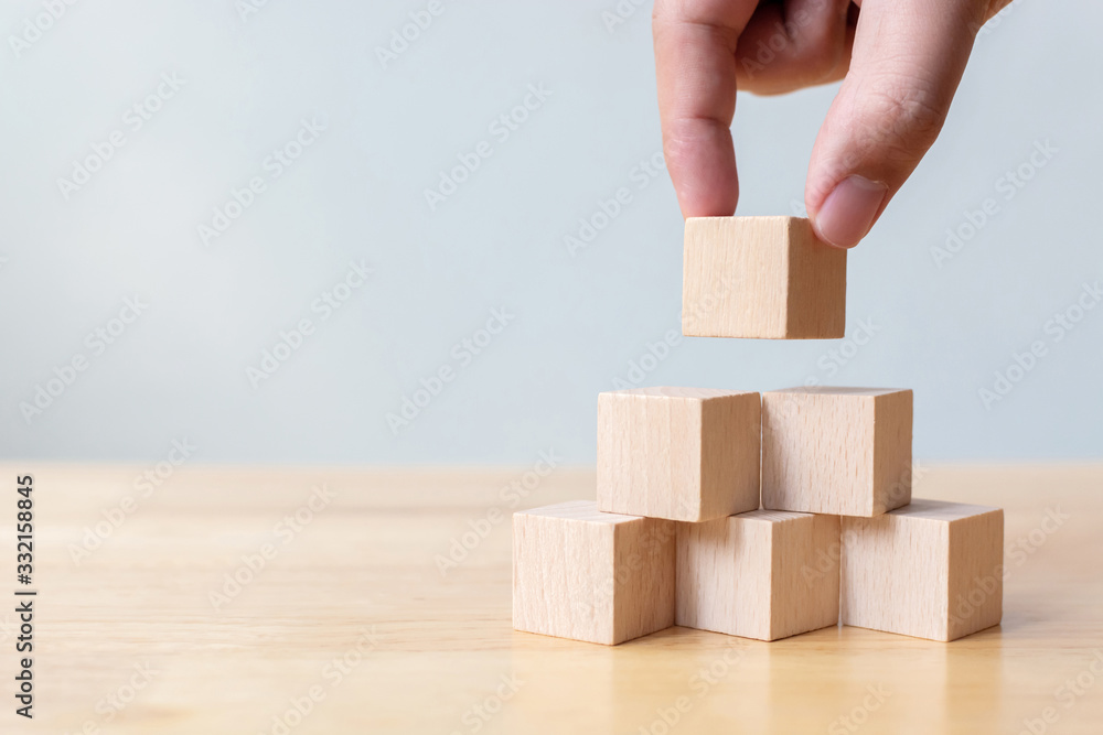 Hand arranging wood block stacking as step stair. Business concept for growth success process Hand arranging wood block stacking as step stair. Business concept for growth success process