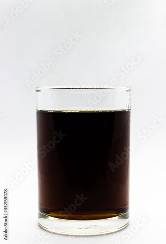 Cola drink in glass isolated on white background, copy space template.