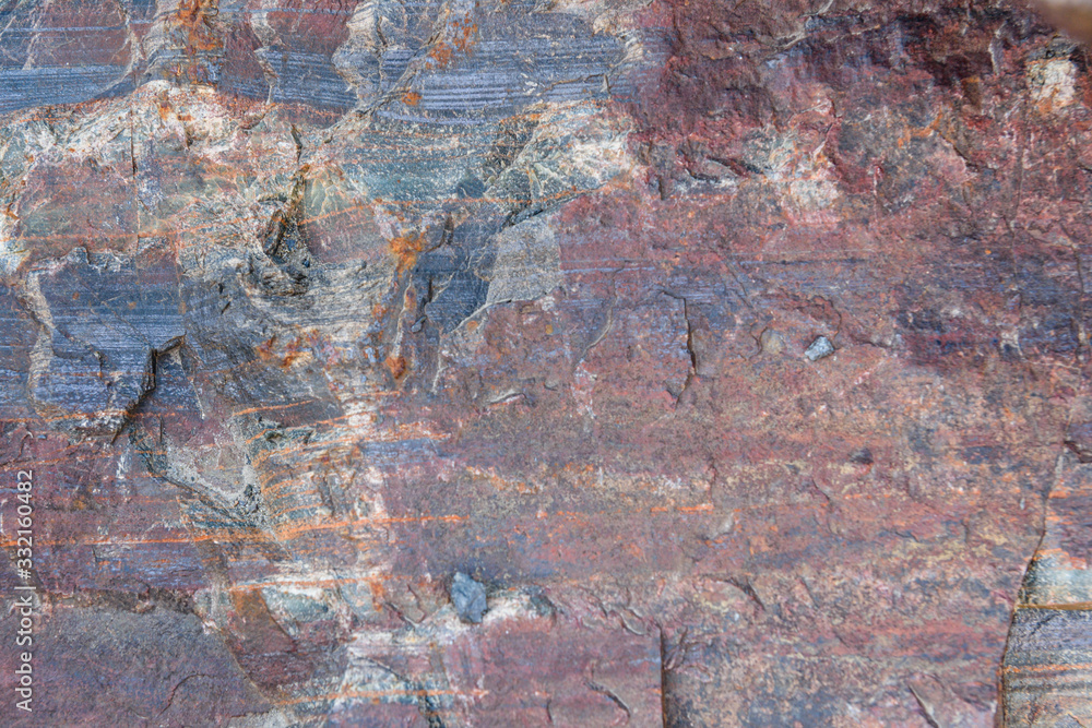 Texture of the stone with layers of iron ore