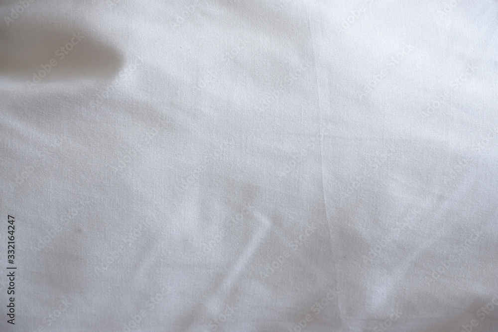 Soft white blanket. The sun's rays fall on the bed linen. Cosiness Soft white blanket. The sun's rays fall on the bed linen. Cosiness