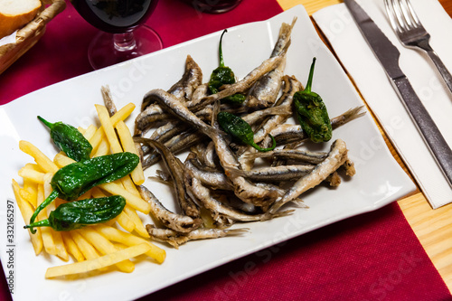 Anchovies with fries and jalapenos photo