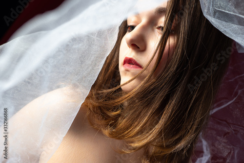 A long-haired girl with a v...