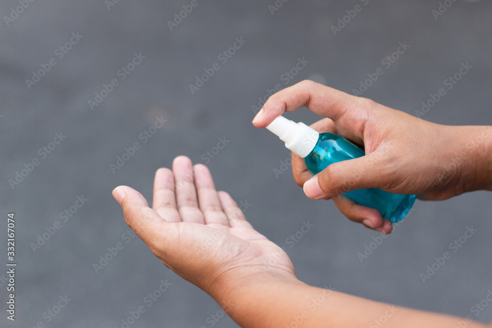 Man hands using alcohol spray for protection bacteria and virus .Coronavirus concept. Man hands using alcohol spray for protection bacteria and virus .Coronavirus concept.