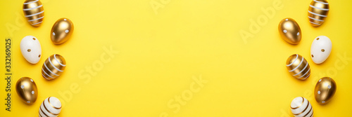 Easter eggs isolated on yellow background. For greeting card, promotion, poster, flyer, web-banner, article.