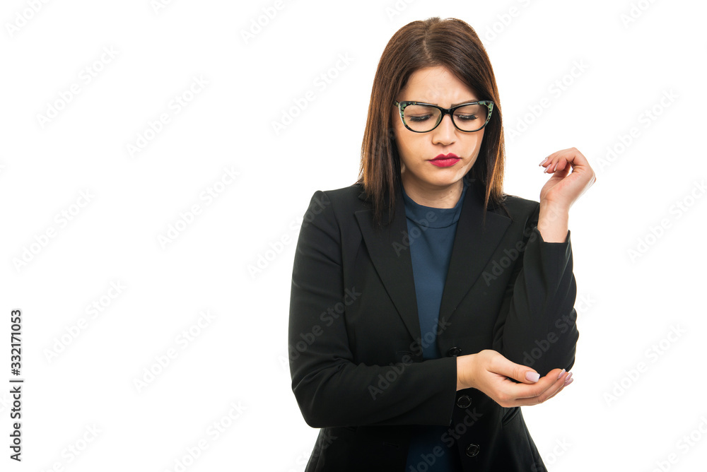 Portrait of business girl wearing making elbow pain gesture Portrait of business girl wearing making elbow pain gesture