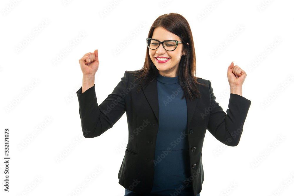 Portrait of business girl wearing making winner gesture