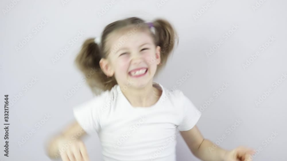 little girl is very happy and shows emotions with her hands. joy, victory, happiness little girl is very happy and shows emotions with her hands. joy, victory, happiness