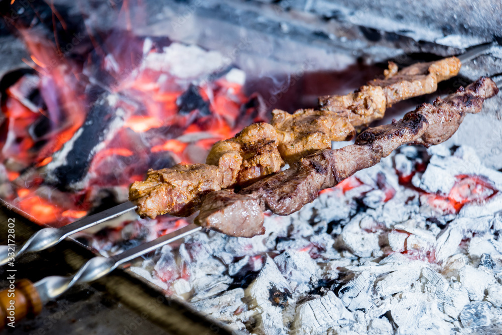 Delicious beef and pork barbecue on grill. Georgian restaurant. Delicious beef and pork barbecue on grill. Georgian restaurant.