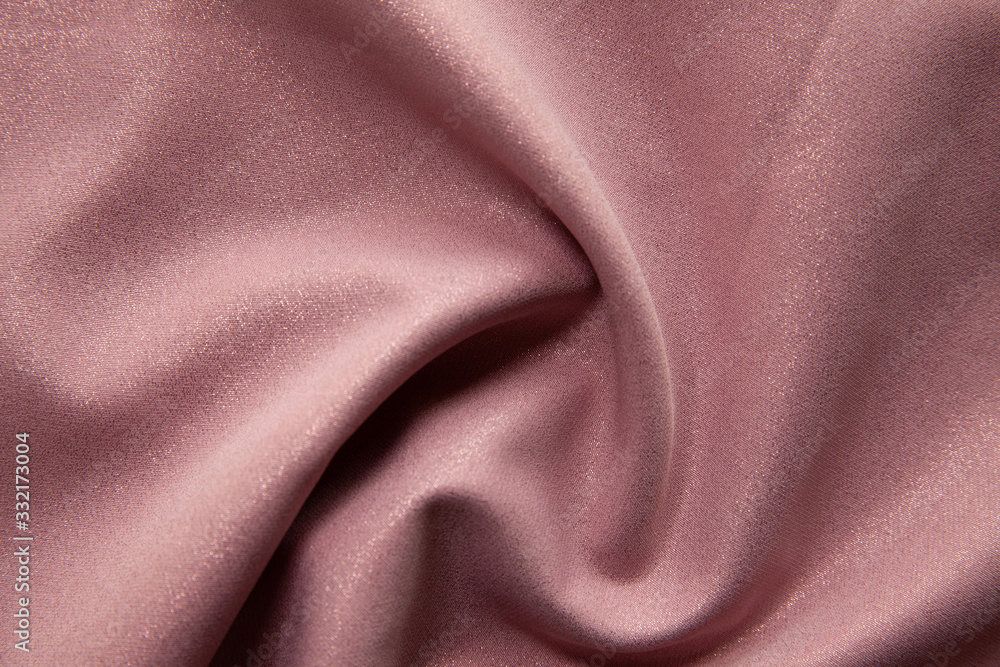 Beautiful fabric of one color is folded on a table in daylight Beautiful fabric of one color is folded on a table in daylight