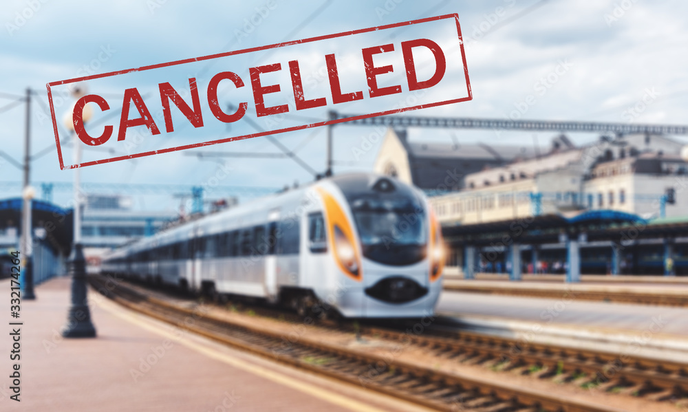 Obraz premium Trains cancelled due to pandemic of coronavirus. Passenger railway travel and transportation cancellation due to epidemic of Covid-19. Background with railway station, high speed train and text