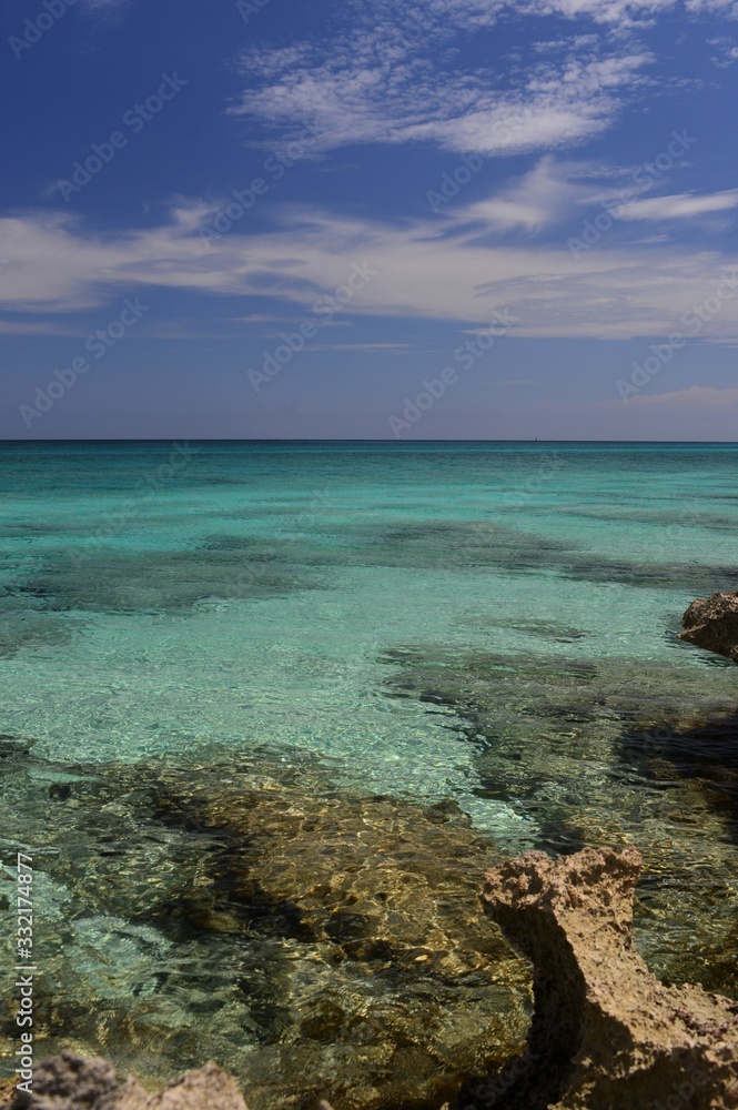 turquoise sea with stones in it in cuba