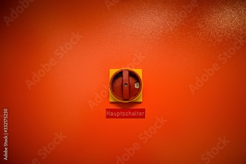 red yellow rotary main switch on orange background