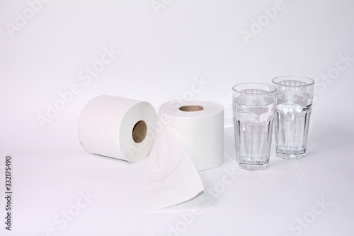 Toilet paper rolls with two glasses of water