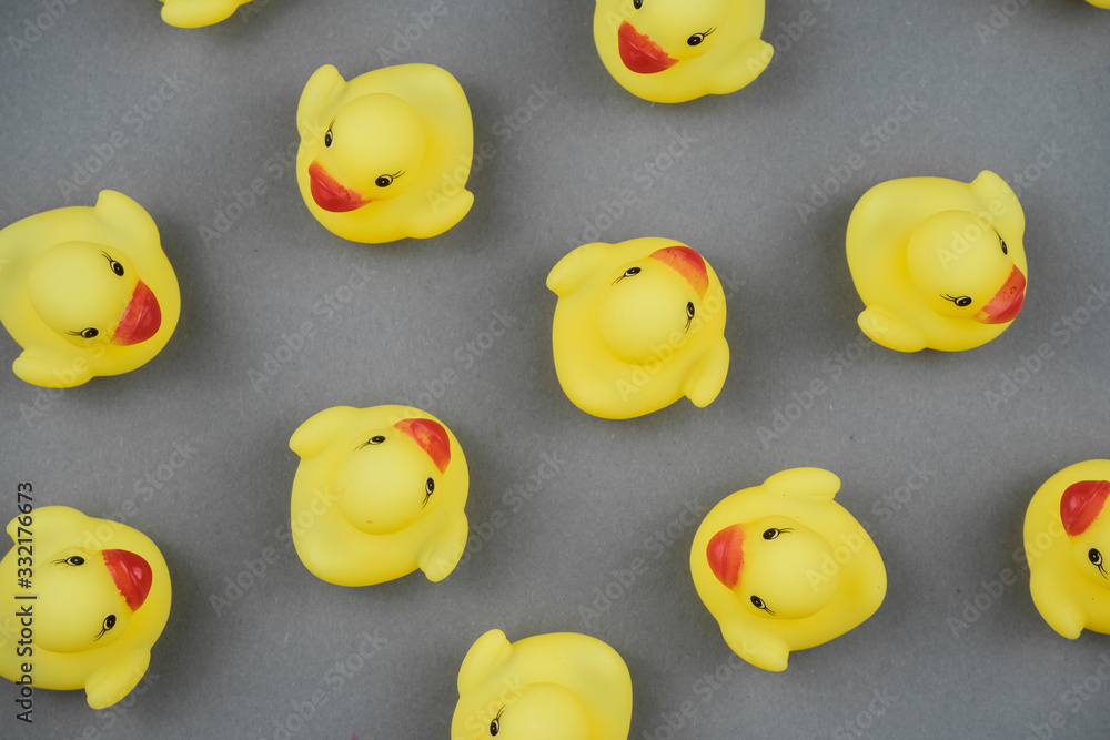Yellow rubber ducks on the green background. Yellow rubber ducks on the green background.