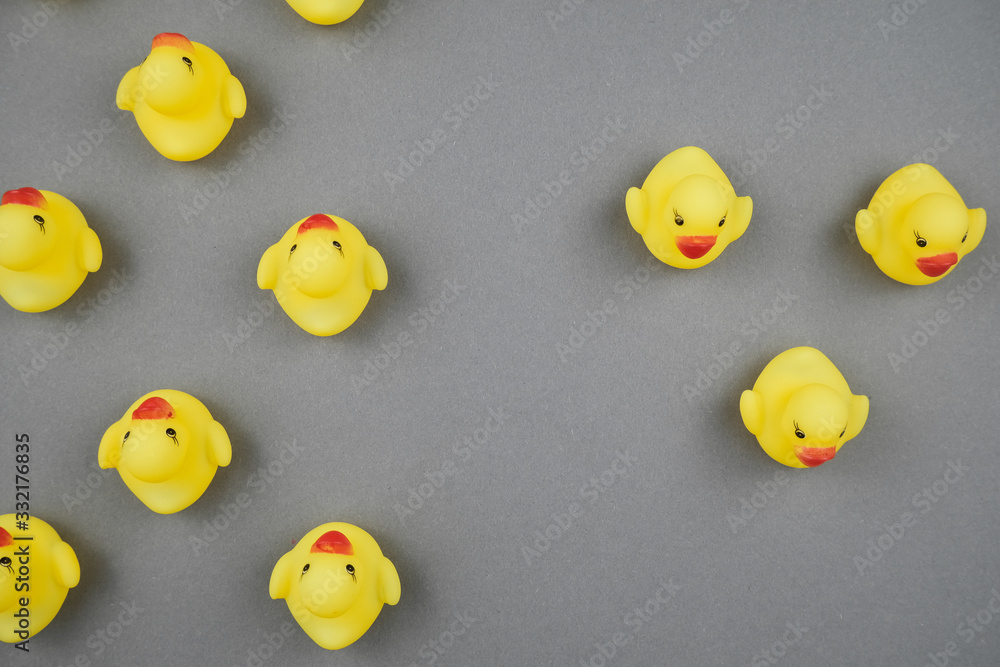 Yellow rubber ducks on the green background. Yellow rubber ducks on the green background.
