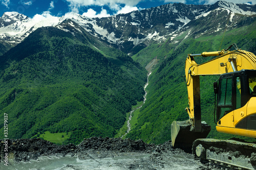 excavator in the mountains