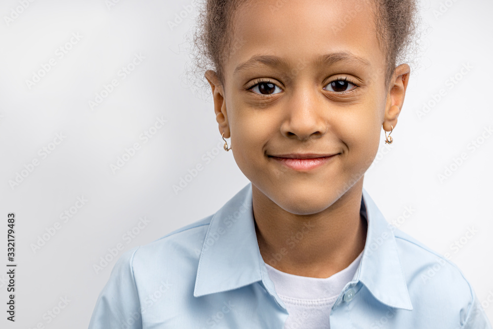 portrait of cute or african kid girl isolated over white background. beautiful shy little girl posing at camera, smile portrait of cute or african kid girl isolated over white background. beautiful shy little girl posing at camera, smile