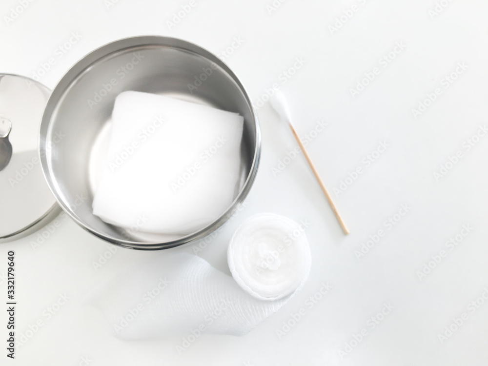 gauze jar and gauze inside with swab and roll gauze with copy space gauze jar and gauze inside with swab and roll gauze with copy space