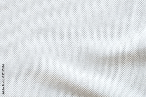 White fabric close up shot of Cotton and polyester Polo shirt. Casual wear over the weekend or summer time season. Background texture concept with copy space for text.