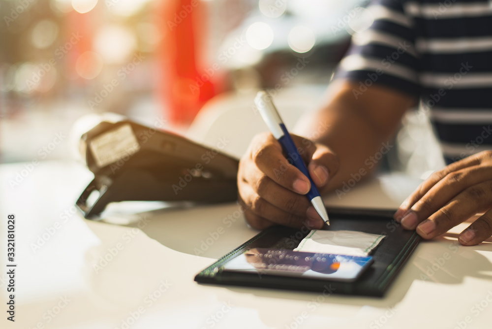 Was signed slip from swipe purchases with a credit card,Financial transactions Concept,Paying credit card. Was signed slip from swipe purchases with a credit card,Financial transactions Concept,Paying credit card.