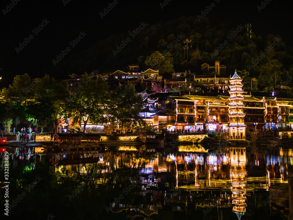 Fototapeta premium fenghuang,Hunan/China-16 October 2018:Scenery view in the night of fenghuang old town .phoenix ancient town or Fenghuang County is a county of Hunan Province, China