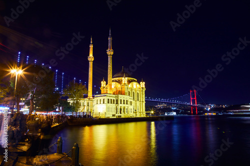 Ortakoy Mosque and Bosphorus Bridge  15th July Martyrs Bridge  night view. Istanbul  Turkey