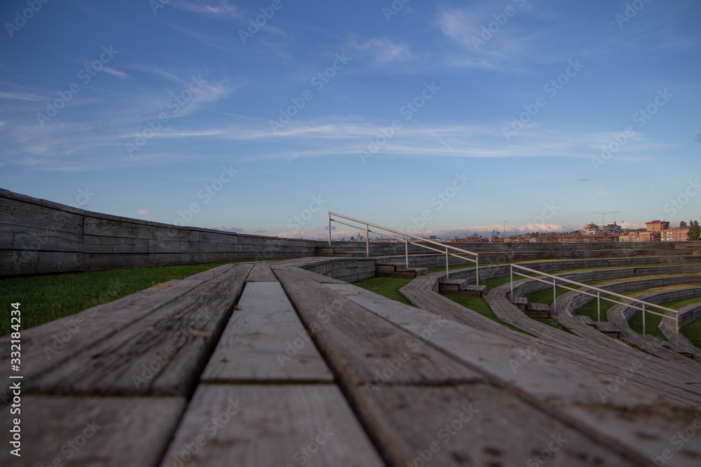 Wooden audience box with stairs and sunny sky in the background Wooden audience box with stairs and sunny sky in the background