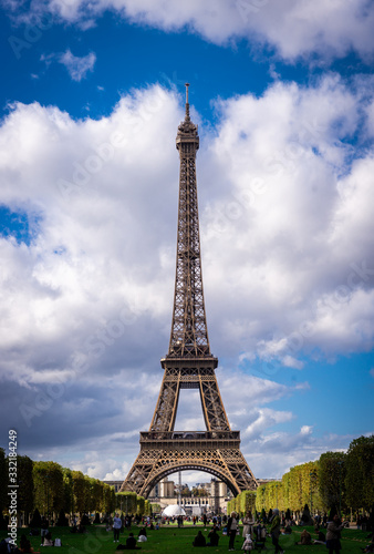 The Eiffel Tower in Paris seen from Champ-du-Mars at clear daytime © Csomos