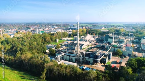 Factory with Pipes and Steam near Burgum - Friesland, Netherlands / Holland – 4K Drone Footage photo