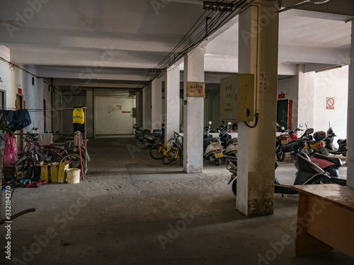 Shantou/china-31 march 2018:electric motorcycle Park in chinese people apartment in Shantou.Shantou city of Teochew people in Guangdong China.electric motorcycle the most famous automobile in china photo