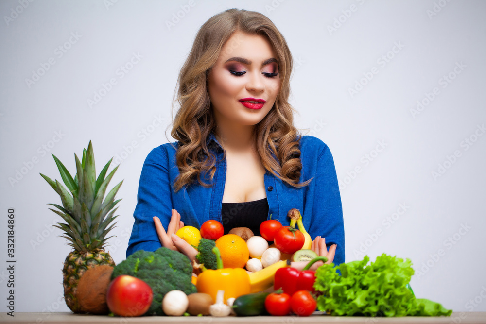 Concept of diet and healthy eating woman with vegetables on white wall background Concept of diet and healthy eating woman with vegetables on white wall background