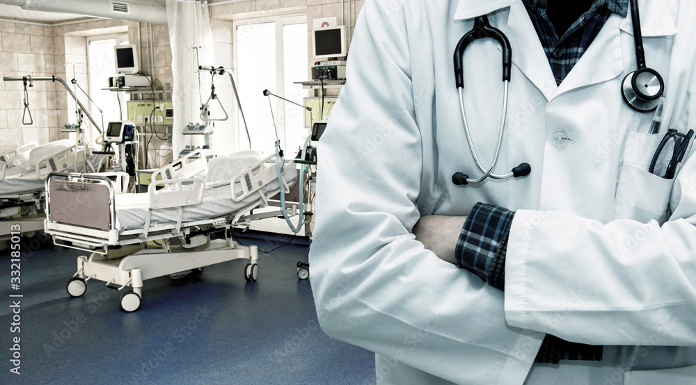 Abstract image with silhouette of a doctor and artificial lung ventilation apparatus in the resuscitation ward to rescue coronavirus patients in a modern hospital.