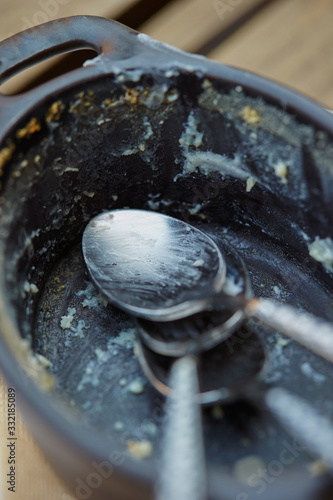 Empty iron dish with spoon 