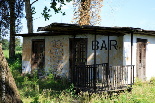 Pavia (PV), Italy - June 09, 2018: An ancient and abandoned bar near Certosa di Pavia, Pavia, Lombardy, Italy photo