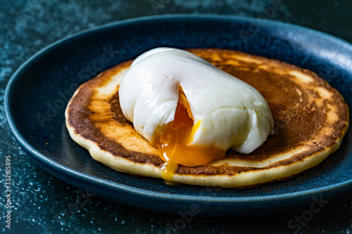 Poached Egg with Pancake in Plate for Breakfast.