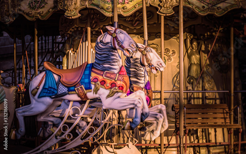 Obraz na płótnie Vibrant horses on a traditional carousel in Montmartre, Paris, France w salonie