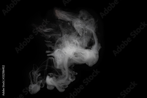 White steam on a black background. © Nikolay